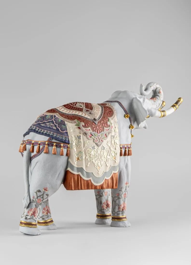 Decorative elephant figurine with intricate patterns on a gray background