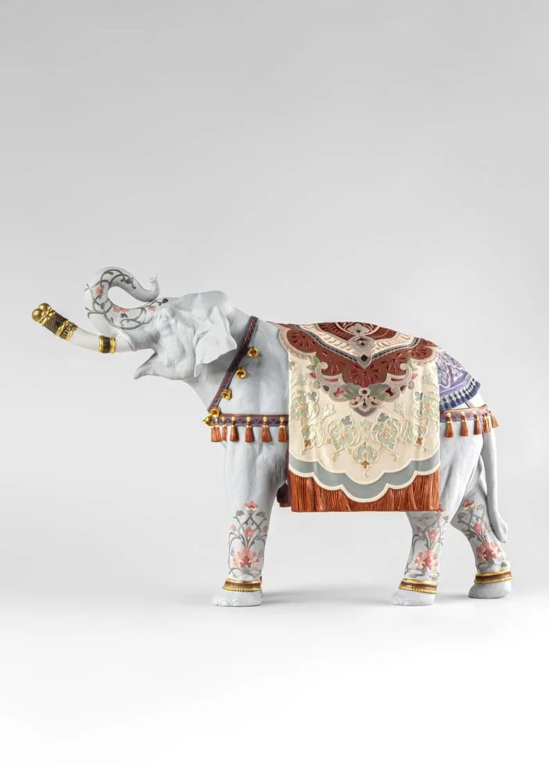 Decorative elephant figurine with intricate patterns on a white background