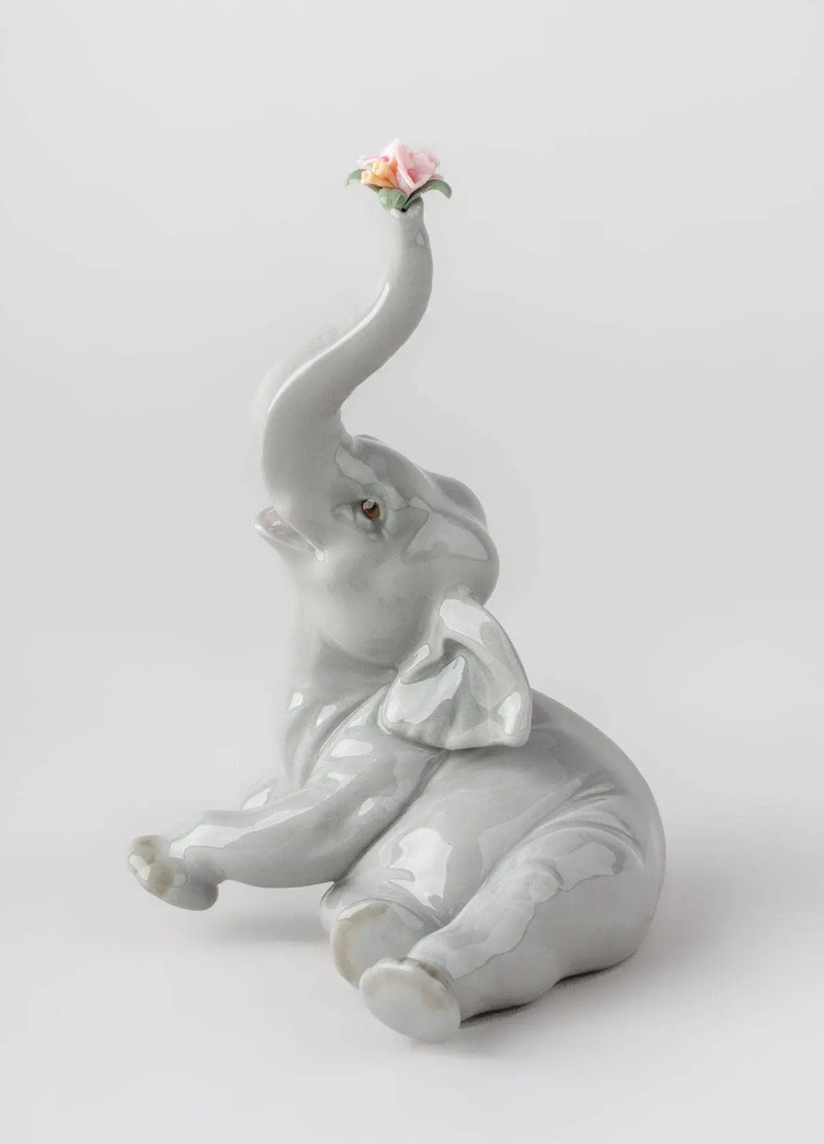 Lladró Baby Elephant with Pink Flower Sculpture | FormFluent