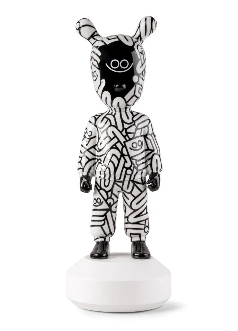 Black and white striped Guest figurine on a white background