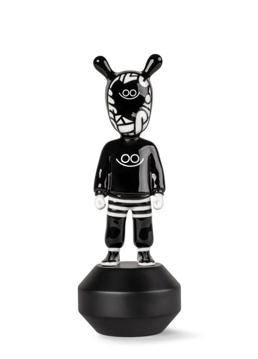 Black and white figurine on a white background