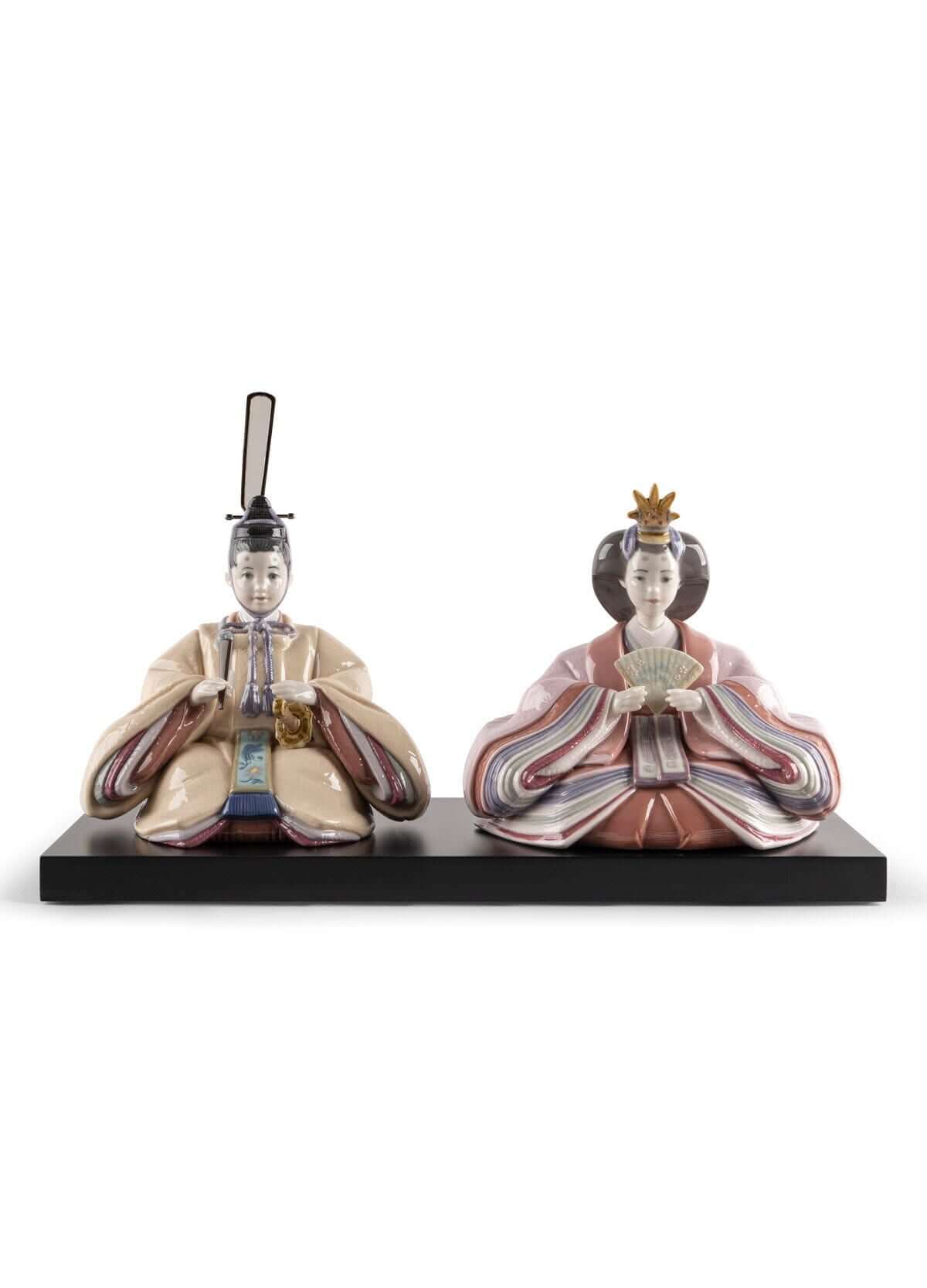 Handmade beige and pink Hina dolls figurines representing Japanese emperors and empresses, beautifully crafted in porcelain.