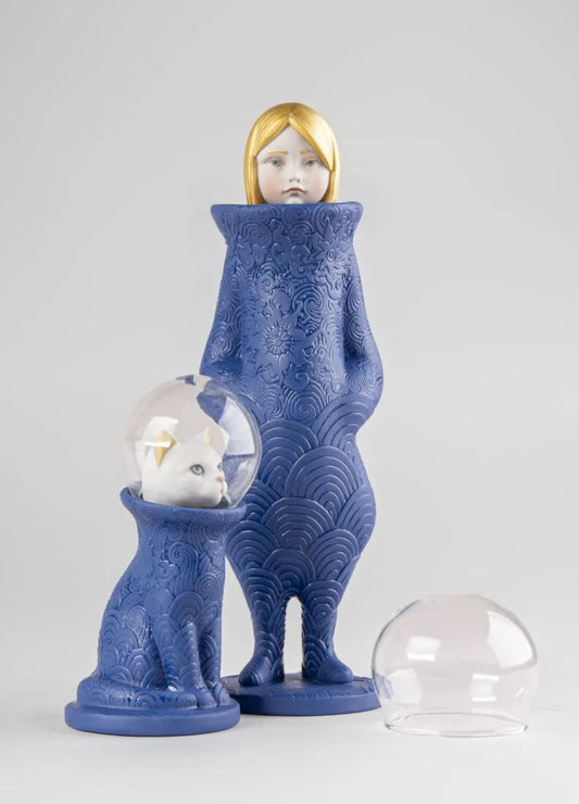 Blue porcelain figure with a cat and a woman inside glass bubbles on a white background