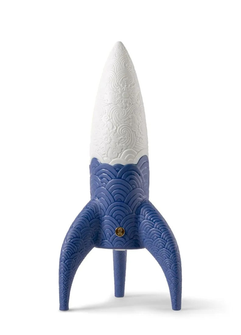 Blue and white rocket-shaped wireless lamp on a white background