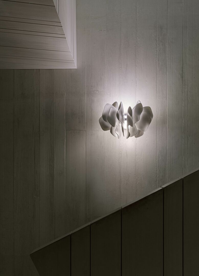 Lladró Nightbloom wall sconce elegantly designed with sculpted flowers for modern interiors