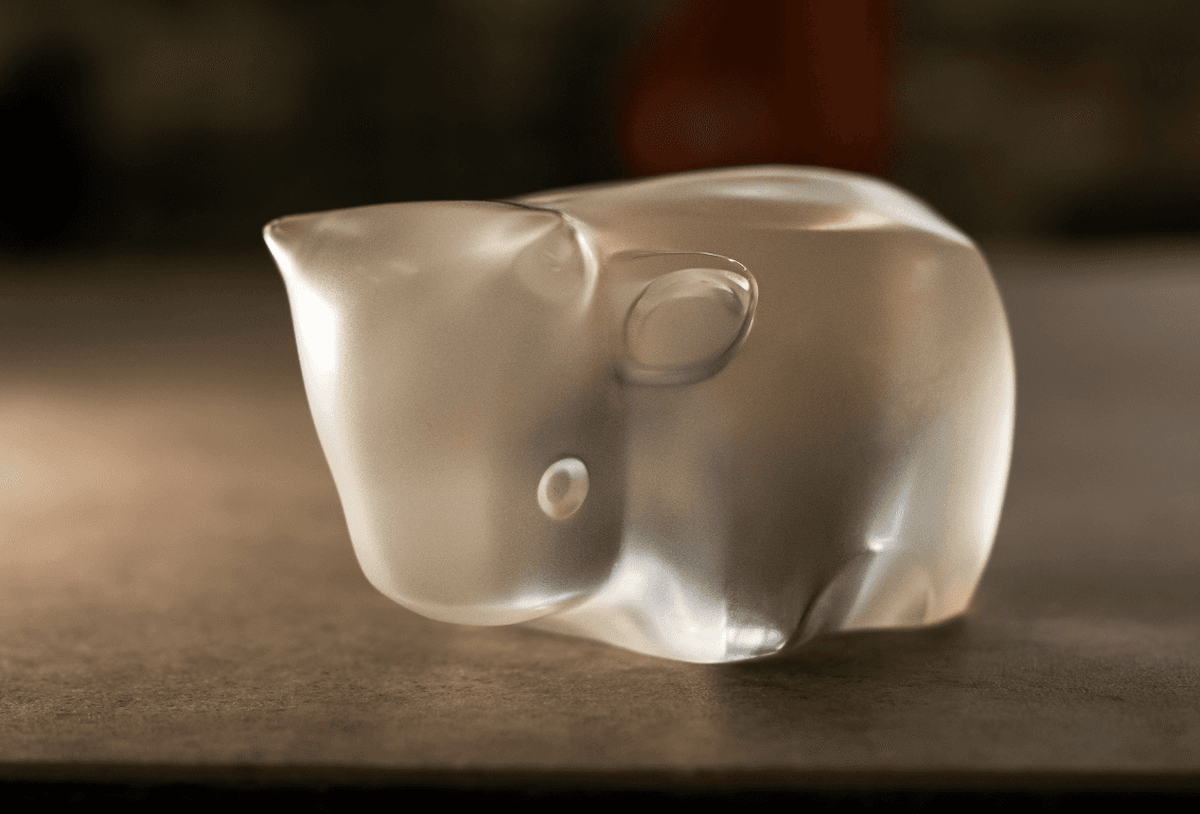 Lalique crystal sculpture of a cow with a smooth finish, showcasing exquisite craftsmanship at FormFluent Australia
