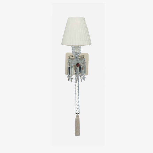 Wall-mounted lamp with a white shade and decorative elements on a light gray background