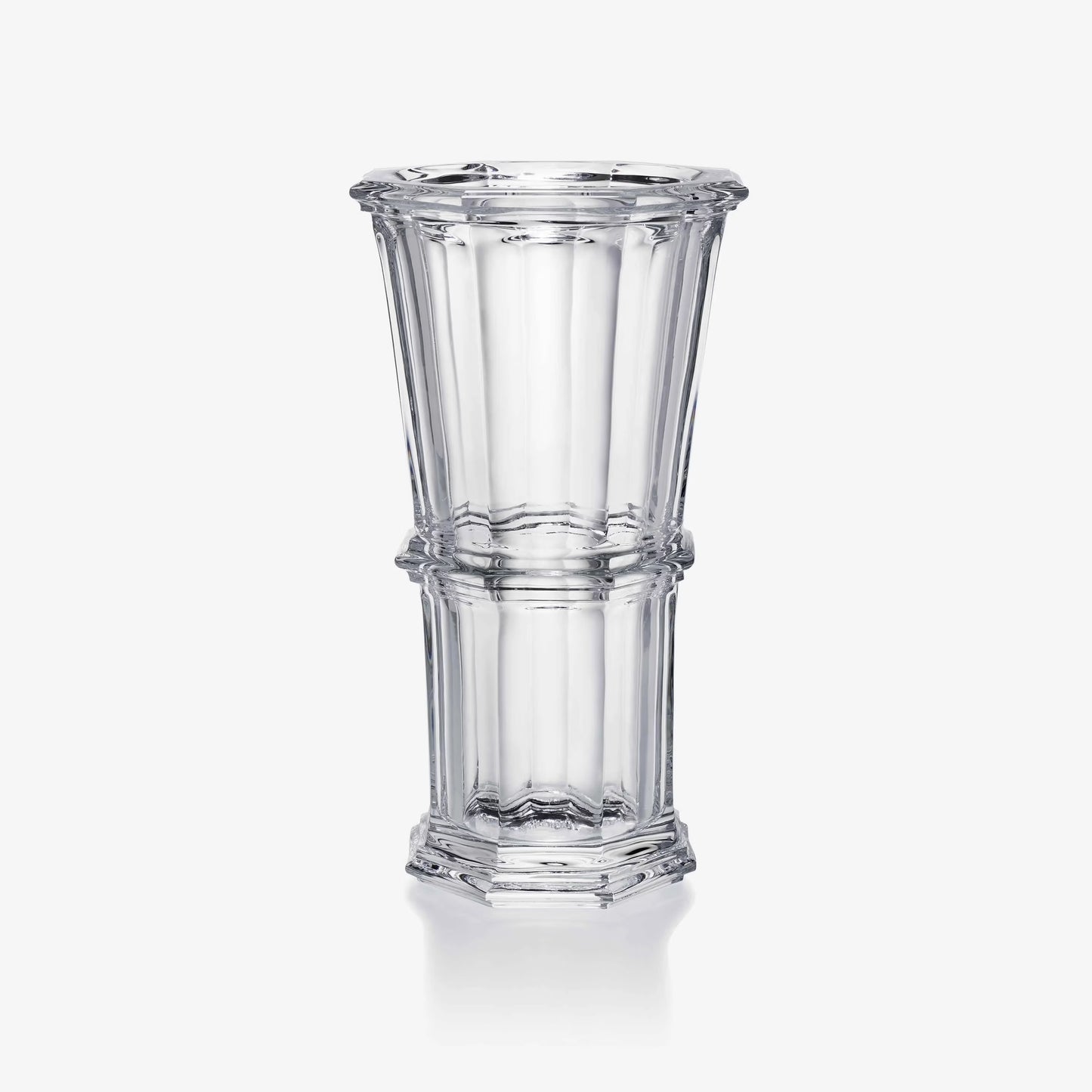 Clear glass vase with a textured design on a white background
