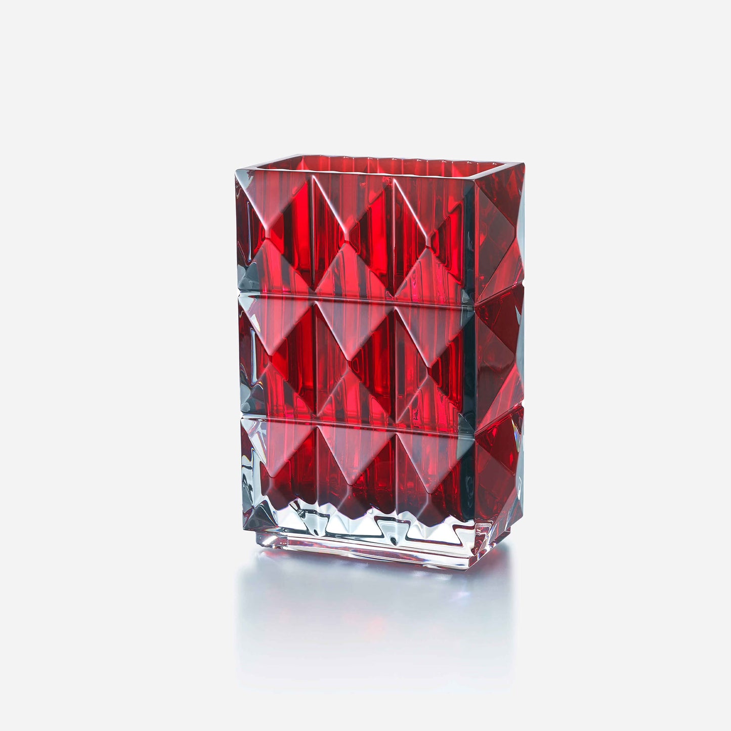 Red crystal glass with geometric design on a white background