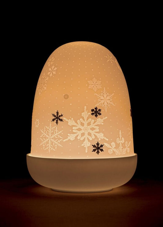 Elegant snowflakes dome table lamp with matt porcelain finish, glowing softly, designed by Formfluent in Sydney, Australia.