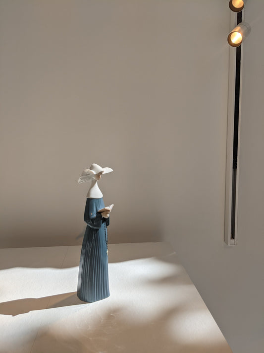 Lladró Prayerful Moment Nun Figurine by Lladró at FormFluent