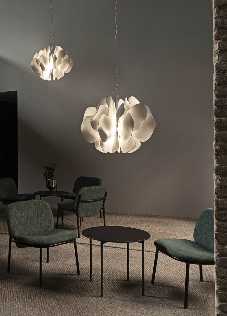 Lladró Nightbloom Hanging Lamp White illuminating a modern seating area with elegant design