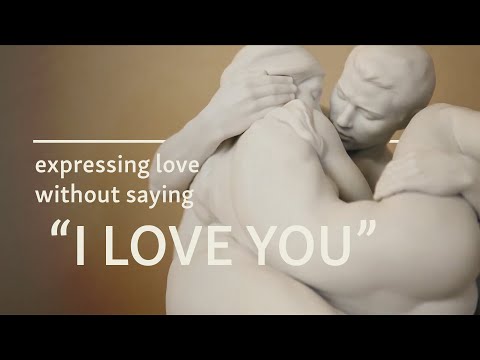 Youtube video of Together Couple sculpture. The text on the thumbnail says: expressing love without saying "I love you"