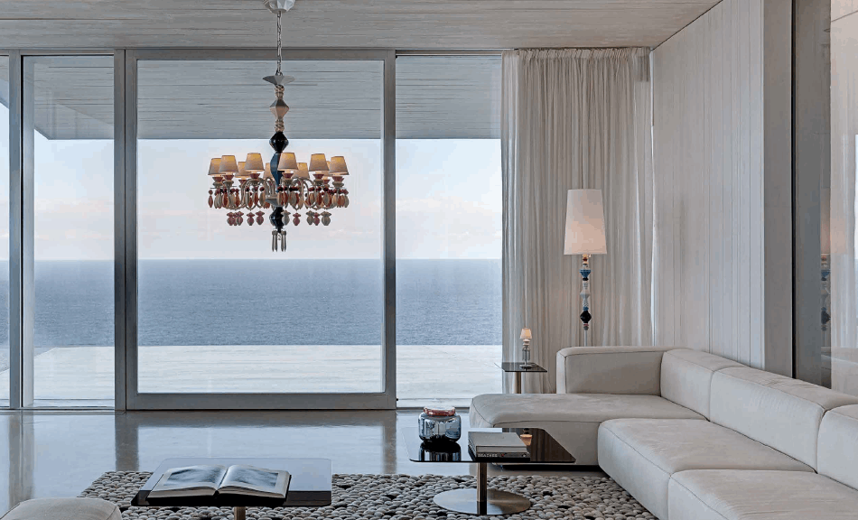 Elegant Lladró chandelier hanging in a modern living room with stunning sea views
