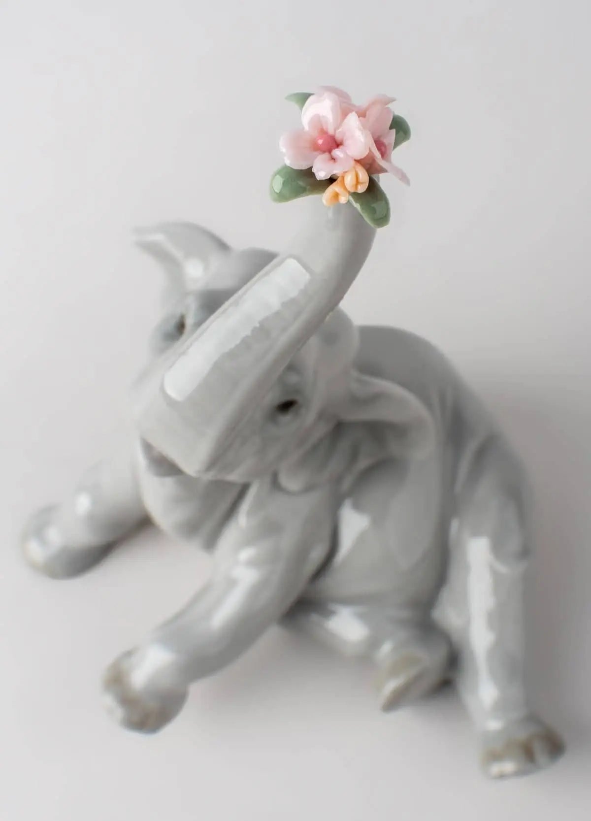 Lladró Baby Elephant with Pink Flower Sculpture | FormFluent