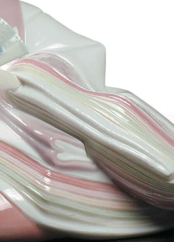 Close-up of Hina Dolls figurine showcasing intricate pink and white porcelain details and elegant craftsmanship.