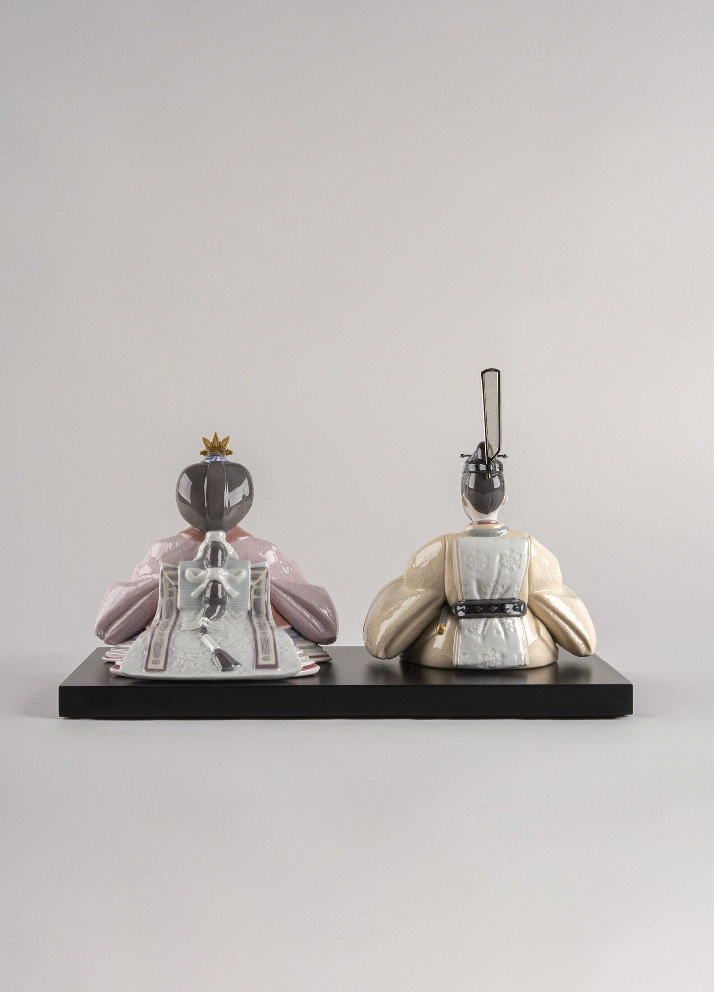 Handmade beige and pink Hina dolls figurine, showcasing traditional Japanese emperor and empress design.