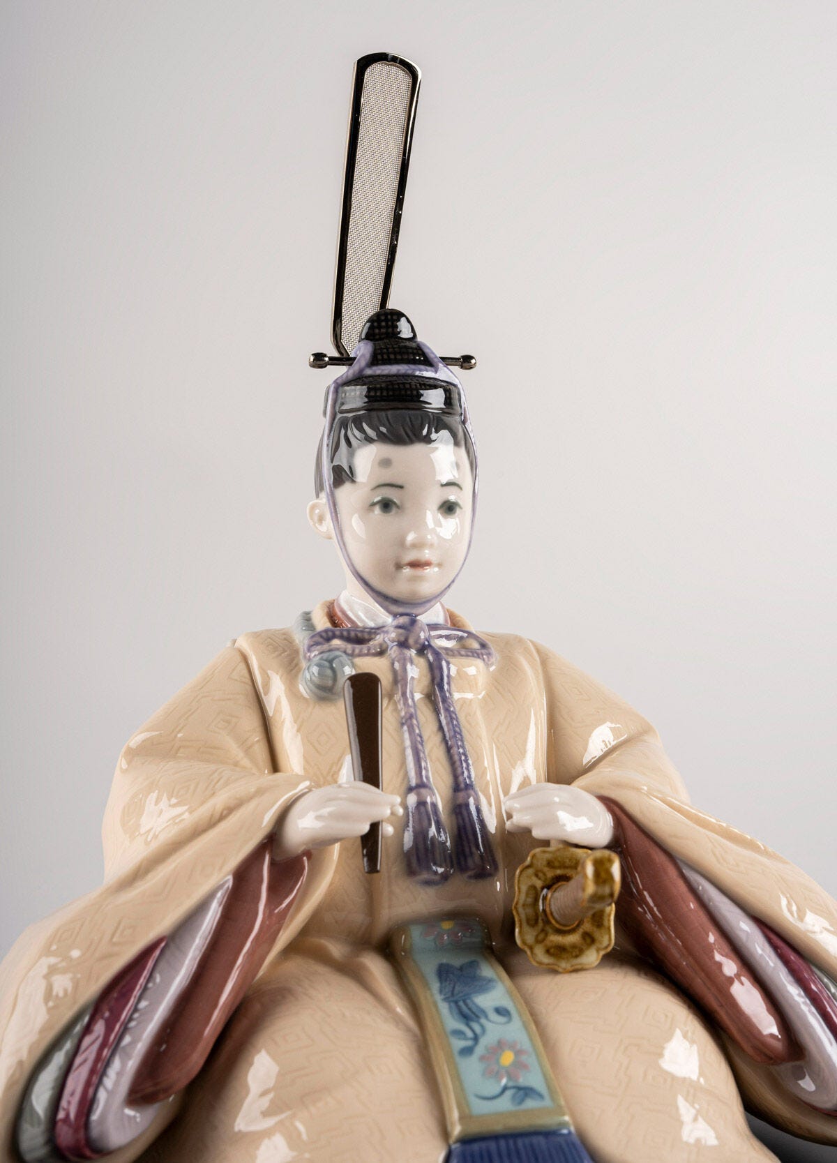 Handmade porcelain Hina Doll figurine in beige and pink, representing Japanese cultural heritage.