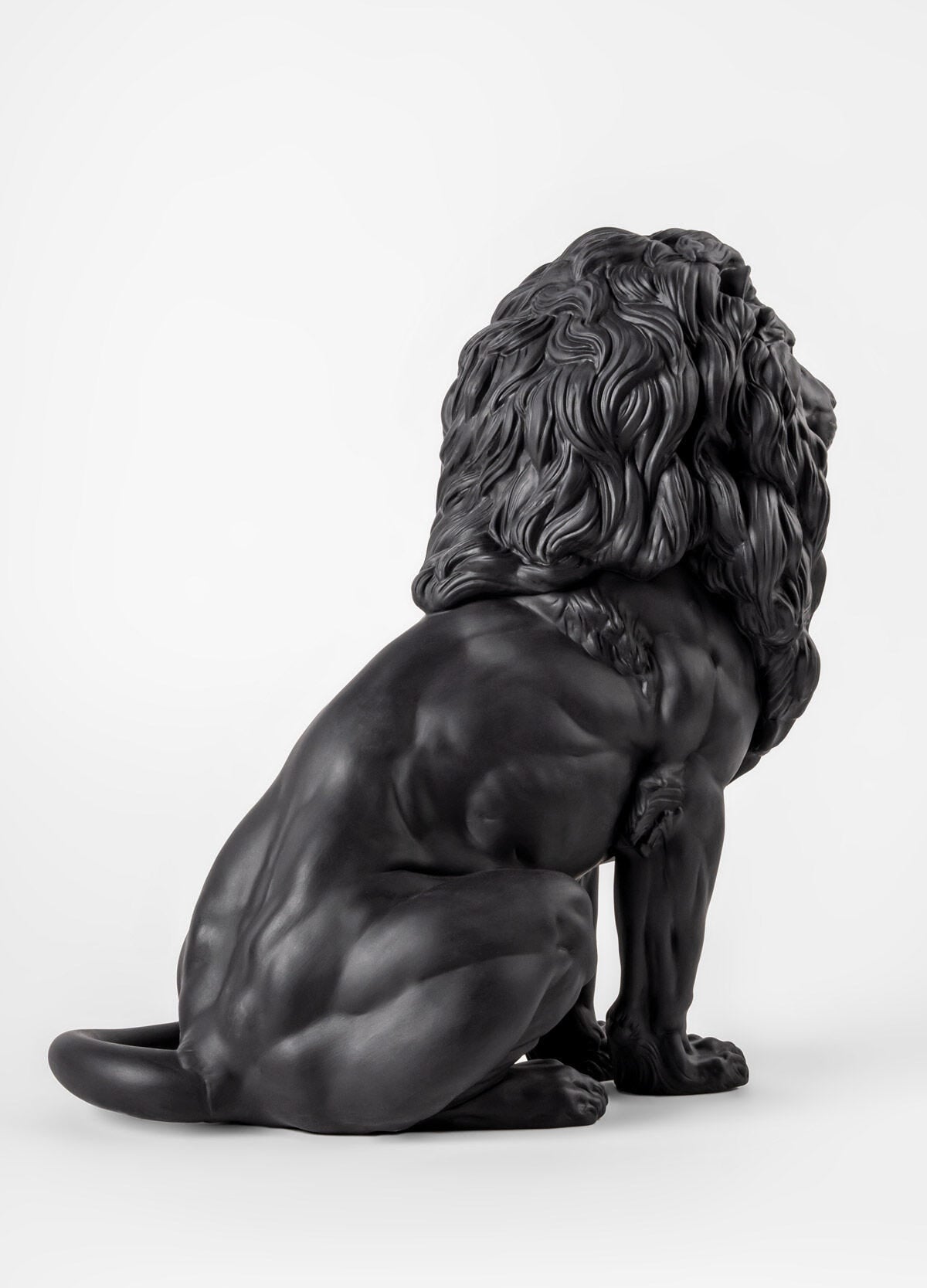 Lladró Majestic Lion Sculpture in matt black porcelain, showcasing a powerful and serene stance, handcrafted in Sydney, Australia.