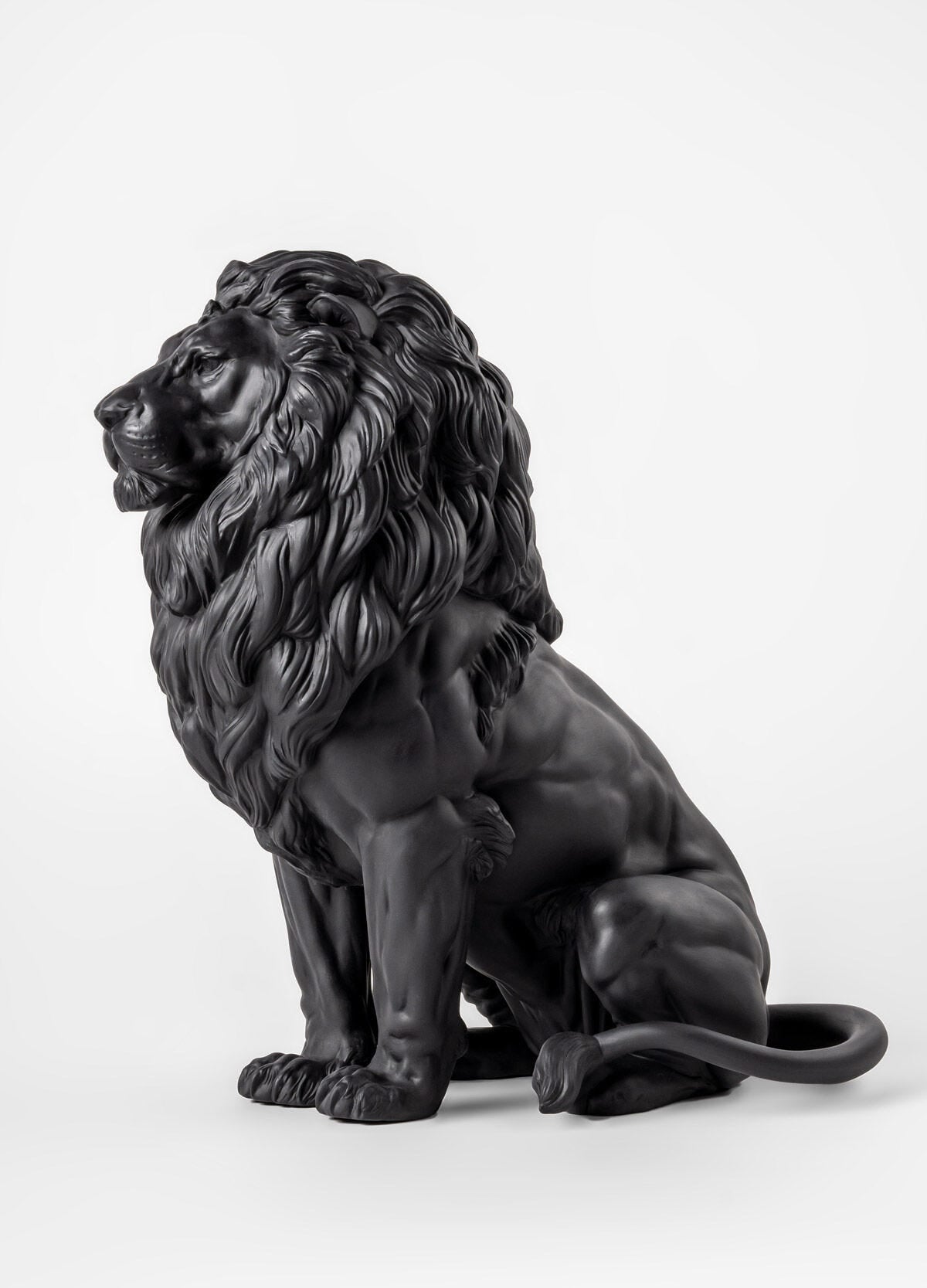 Lladró Majestic Lion Sculpture in matt black porcelain, showcasing strength and elegance, from FormFluent Sydney Australia.