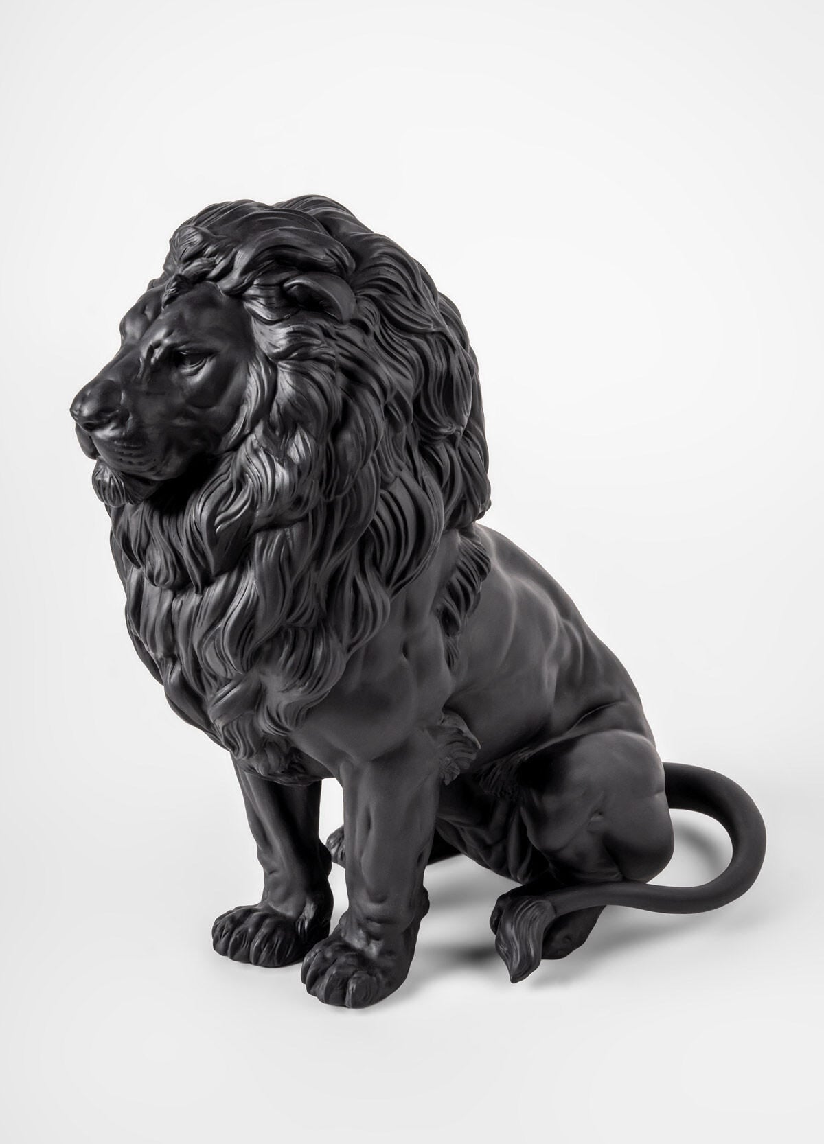 Lladró Majestic Lion Sculpture in matt black porcelain, showcasing strength and nobility, from FormFluent Sydney Australia.