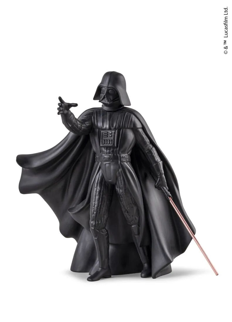 Black Darth Vader figurine holding a red lightsaber on a white background