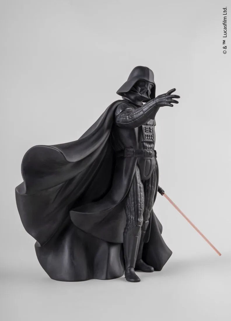 Sculpture of Darth Vadar in dark robes with a cape on a gray background