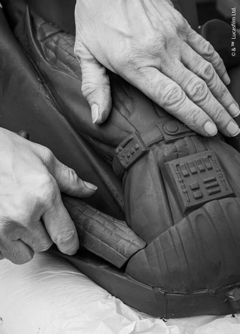 Close-up of hands adjusting a car seat cover with visible stitching details.