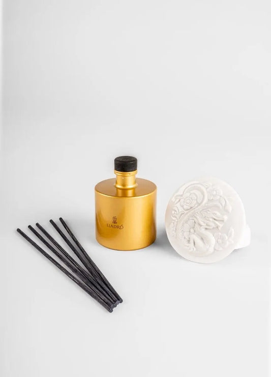 Lladró scented diffuser set with gold bottle, ceramic dish, and black reeds for elegant home fragrance
