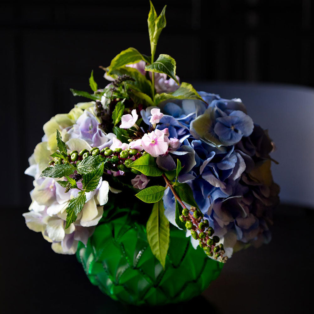 Languedoc Small Vase Lalique adorned with a flower arrangement