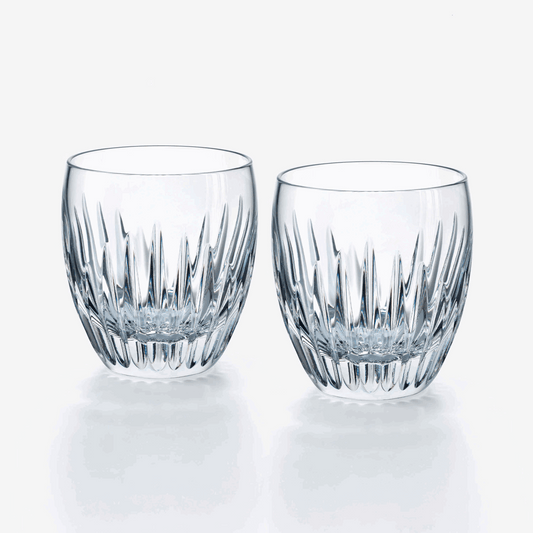 Two clear crystal tumblers with a textured design on a white background