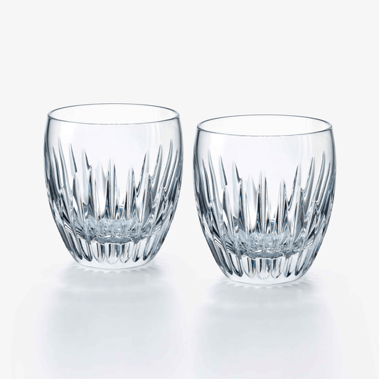 Two clear crystal tumblers with a textured design on a white background