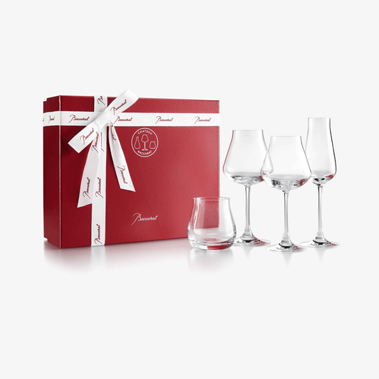 Set of wine glasses with a red gift box featuring a white ribbon on a white background