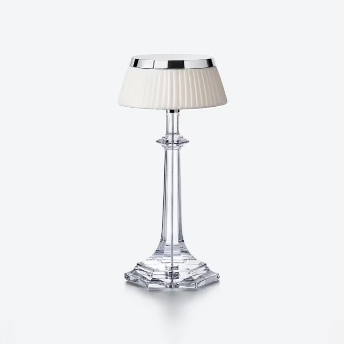 Baccarat Table lamp with a clear base and white shade on a white background