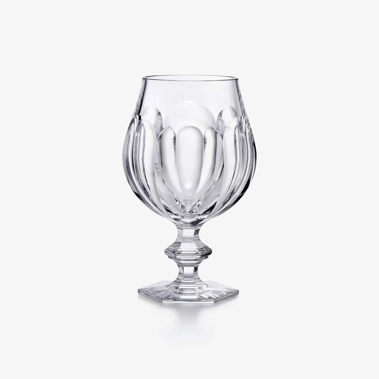 Clear glass goblet on a white background