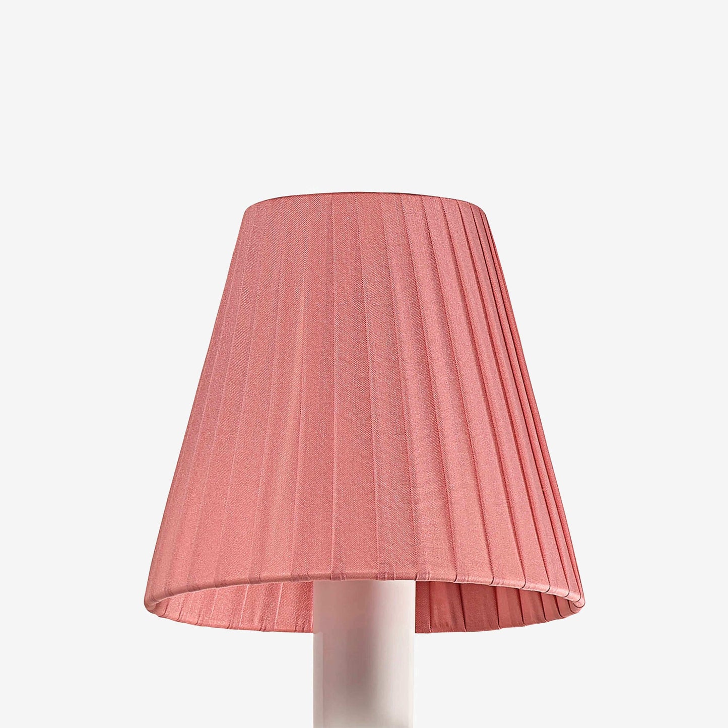 Pink pleated lampshade on a white background
