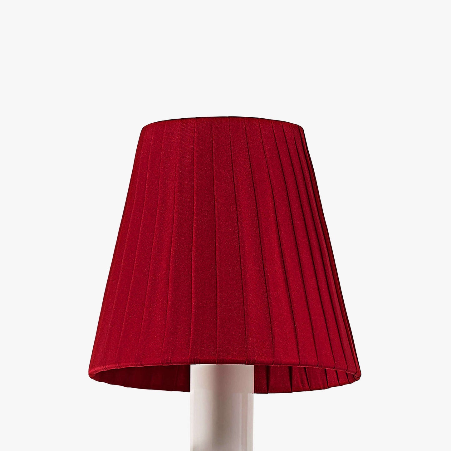 Red pleated lampshade on a white background