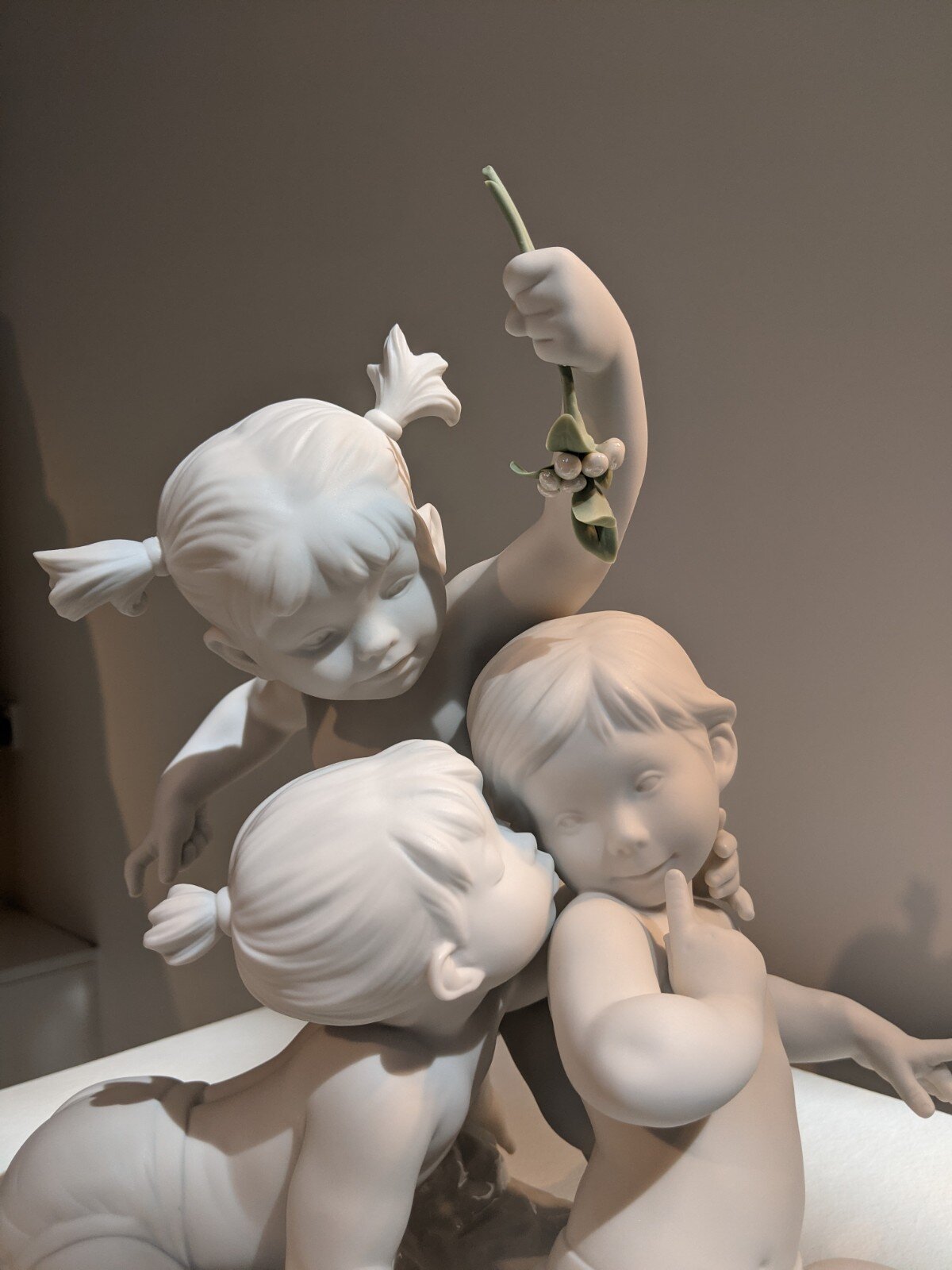 Kiss under the mistletoe children sculpture
